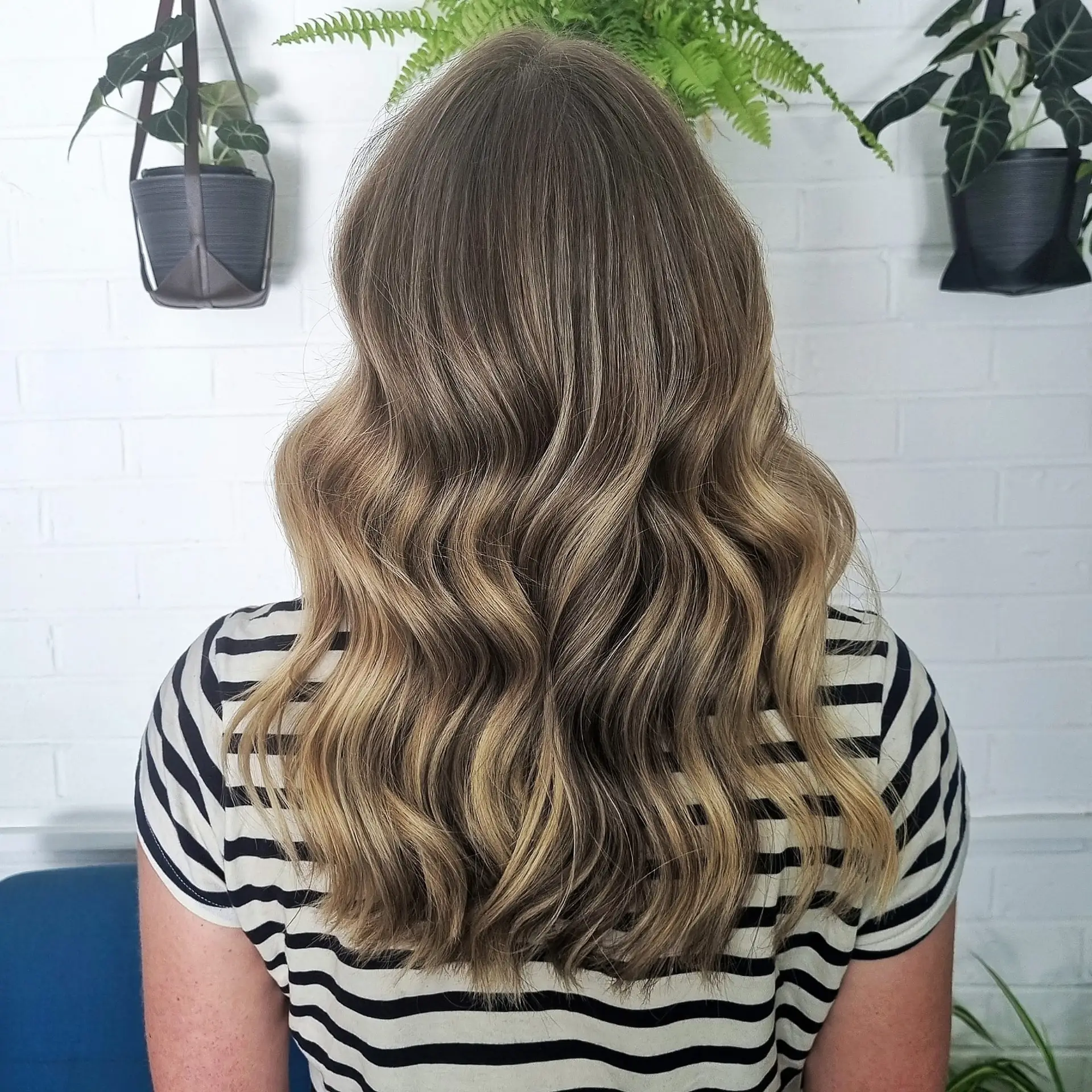 Natural balayage hair colour with soft blended tones at Slinky Hairdressing
